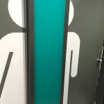 Toilet signage with artistic male/female