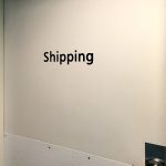 Door with "Shipping" signage